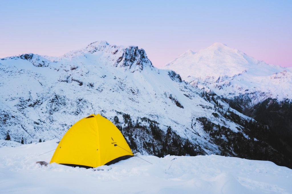 Ultimate Guide to Winter Hiking and Camping - winter tent sunrise