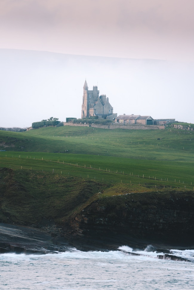 Classiebawn Castle - Ireland's Wild Atlantic Way is a breathtaking coastal route that's bursting with things to do, spectacular views, castles, and quaint towns. Find out some must-see stops for a week long Wild Atlantic Way road trip, starting in Dublin and ending near Galway! By Renee Roaming, your course for trip inspiration, destination guides, and dreamy travel photography. 